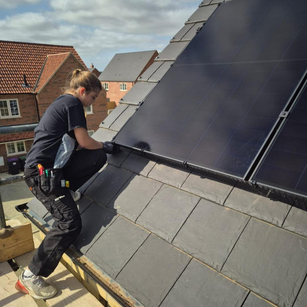 Poppy from Imp Electrcial fitting some solar panels