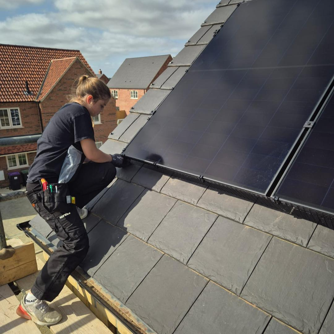 Poppy from Imp Electrcial fitting some solar panels
